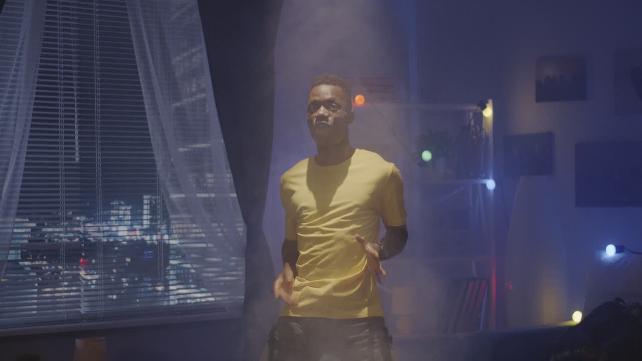 Man Dancing in His Room at Night