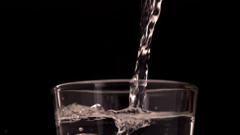 water pouring into a glass