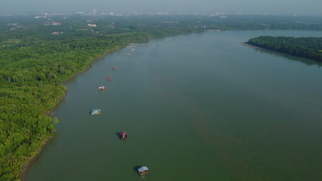 floating house on surface of the bagan lalang river in malaysia