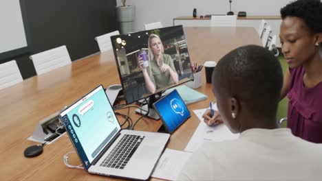 african american businesswomen using computers with data processing in office