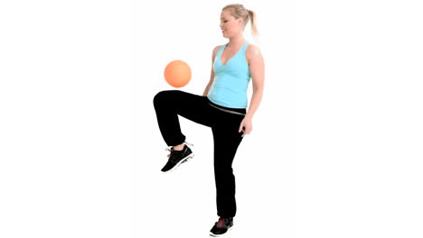 Woman-playing-with-an-orange-ball-in-slow-motion