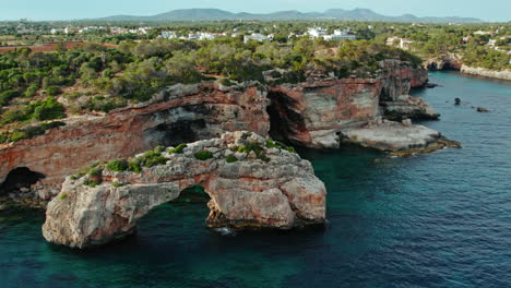 natural rock arch es pontas and mirador de es pontas near cala llombards in mallorca, spain