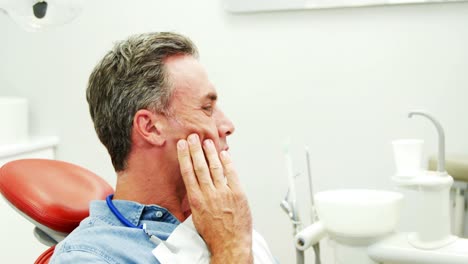 unhappy man having a toothache