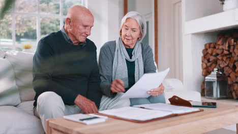 senior couple, planning bills and home budget