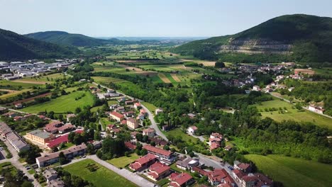 forward drone shot above ponte san quirino, italy, surrounded by mountains