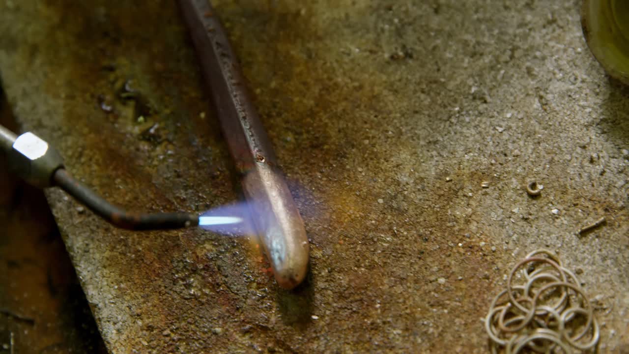Welding piece of metal in workshop 4k