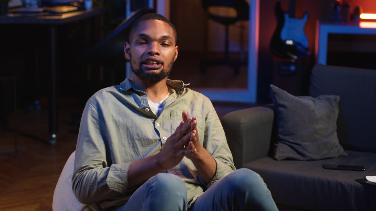 Vertical Video African american person smiling and chatting during a video call at home