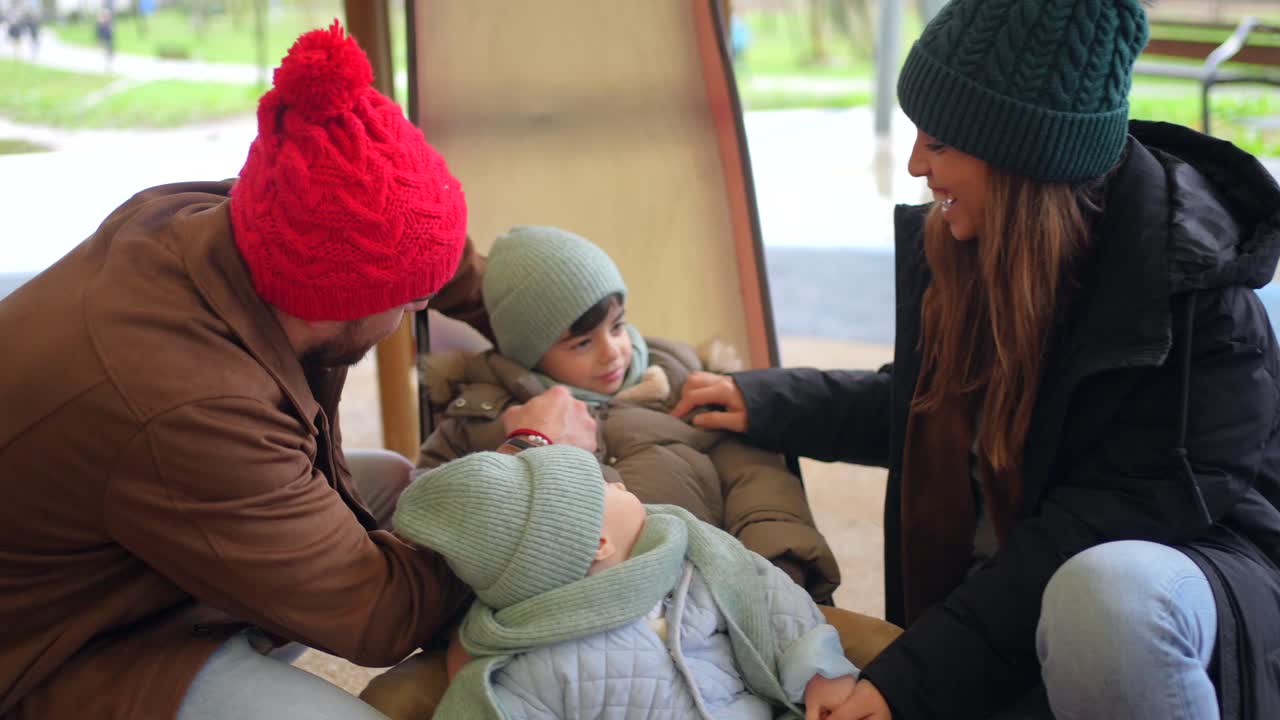 Family having fun on a slide