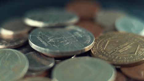macro video of vintage rare coins, retro money edition, old gold, on a 360 rotating plate, 120 fps slow motion