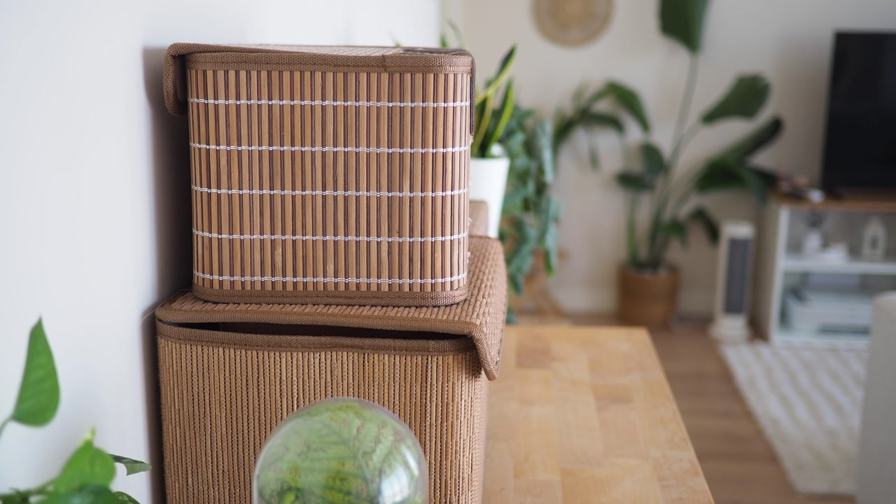 Bamboo Storage Boxes on a Wooden Table in a Cozy Living Room