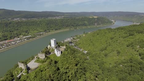 drone flies smoothly over a castle on a mountain