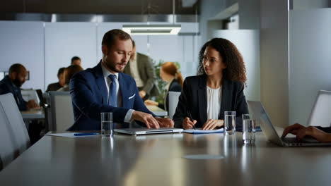 business professionals collaborating in a modern office meeting