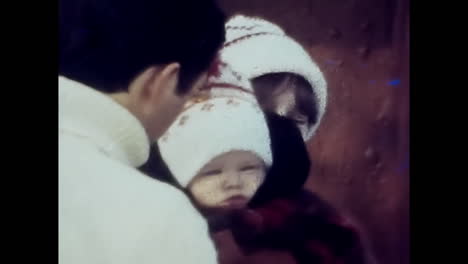 soviet man holding baby wrapped in blanket, symbol of love and hope in communist era. circa ussr 1980s: a heartwarming video of a man from the soviet union cradling a baby lovingly wrapped in a cozy blanket, evoking sentiments of love and hope during the era of communism.
