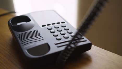 woman call on classic wired phone