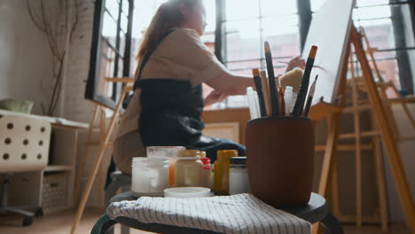 artist painting on a canvas