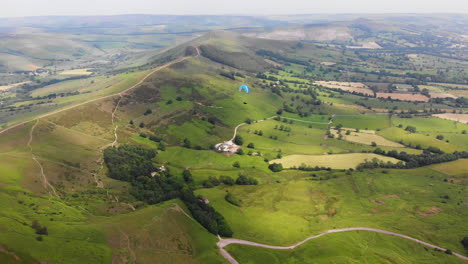 Amazing-aerial-video-of-paragliding-over-green-area