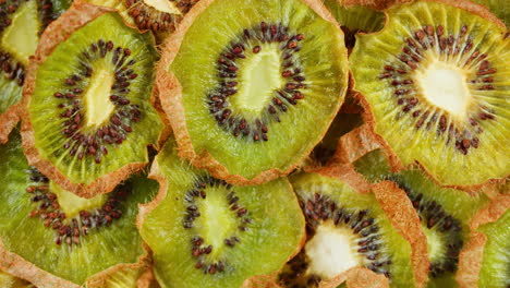 kiwi slices close up background of green, fresh fruit texture.