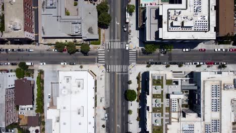 Aerial-birds-eye-view-road-junction-with-cars-driving-in-American-city