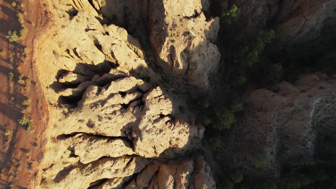 Gullies and ravines from a bird's eye view. Badlands. Ravines and cliffs. Aerial view. Desertification. End of the World viewpoint. Purullena. Granada. Spain