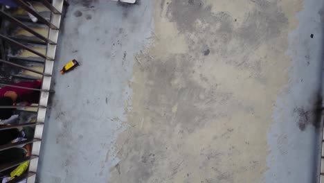 top-down view of exterior stairs and people walking