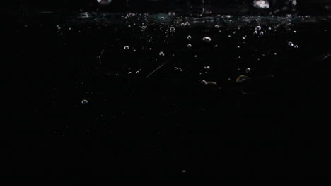 Slow-Motion-Sunglasses-Drop-in-Water-with-Bubbles-Lost-Forever