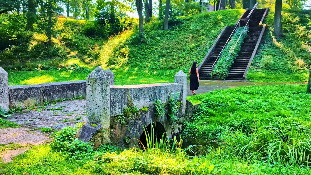 Scenic Park View with Bridge, Stairs and Woman
