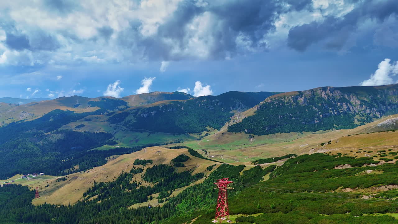 Scenic view of Busteni mountain landscape in Romania. Breathtaking view of mountains and lush valleys in Busteni, Romania. Clear sky with dynamic clouds enhances the scenery