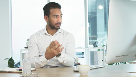 Business-man-using-using-sanitizer-while-working