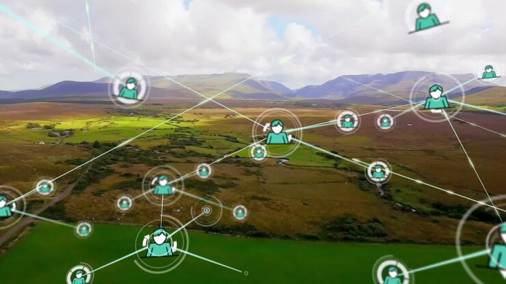 Animation of network of connections with icons over landscape and sky