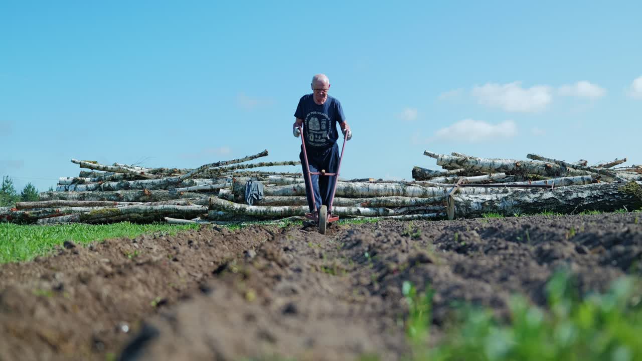 Slow motion shot of farmer using simple tool symbolizing war crisis agriculture