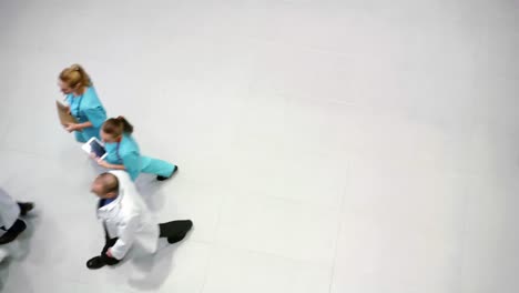 team of doctors walking in corridor