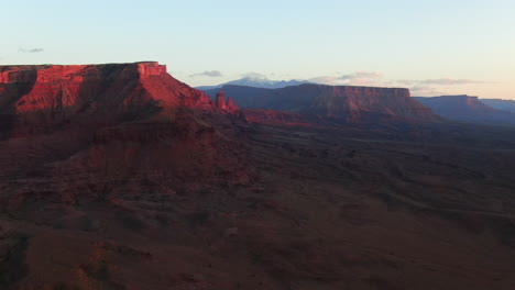 aerial cinematic drone dramatic moab utah orange red sunset mountain snow peak big enchilada landscape arches national park castle valley castleton fishers tower camping colorado river slowly upward