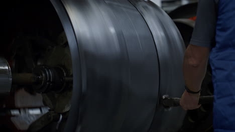 tyre production factory employee controlling manufacturing process closeup