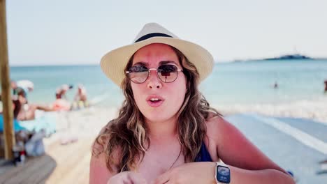 athens beach day: young woman sunbathing