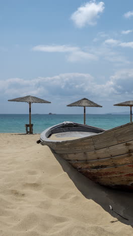 maragkas-beach-in-naxos-island-greece-with-sun-umbrellas-in-vertical