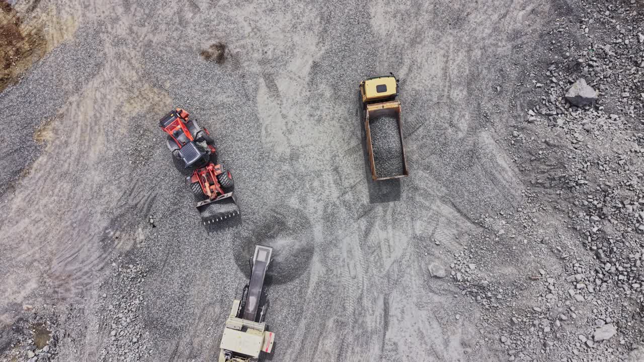 Aerial View of Heavy Machinery Working in a Stone Quarry