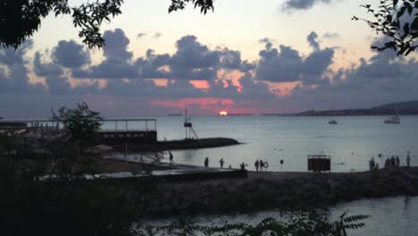 sunset at the beach with people