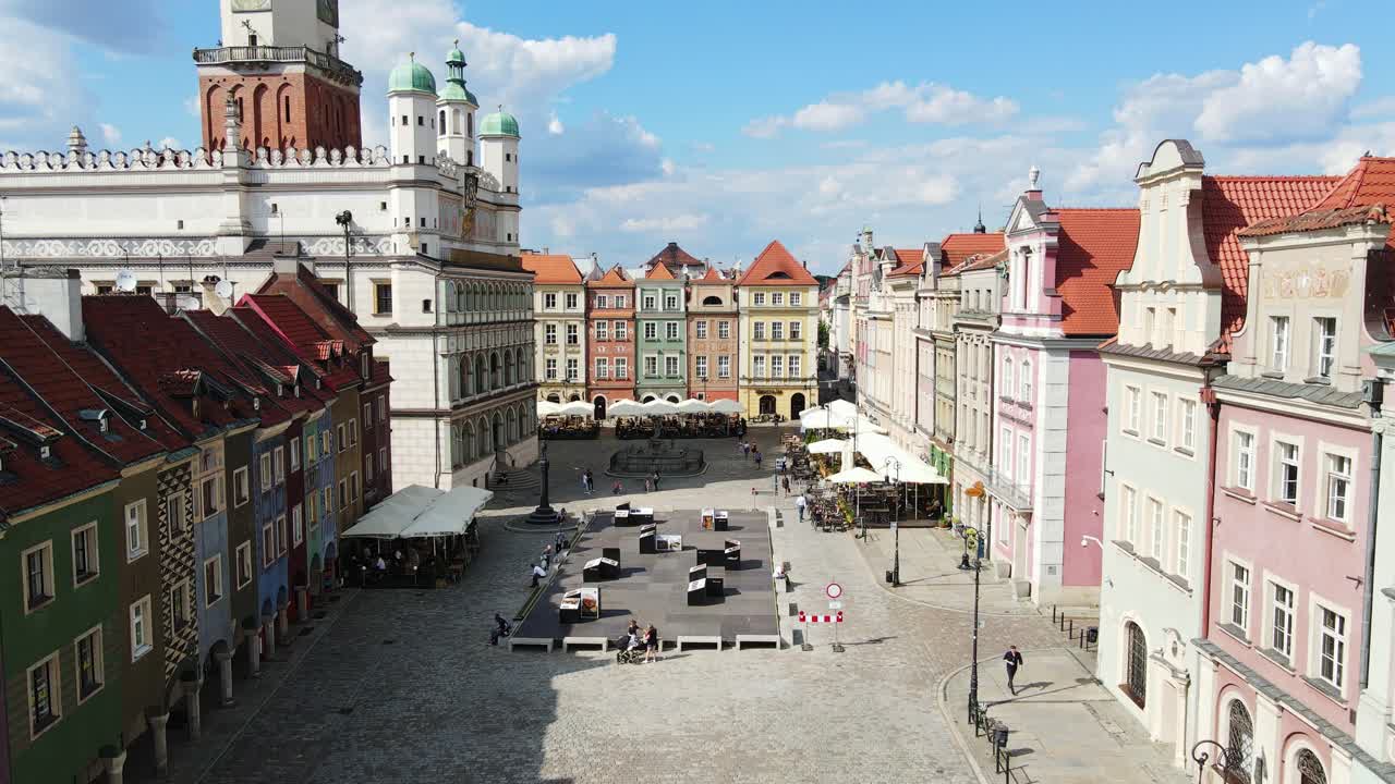 Beautiful summer day over Poznan main square, cafes colorful rooftops charm, 4K