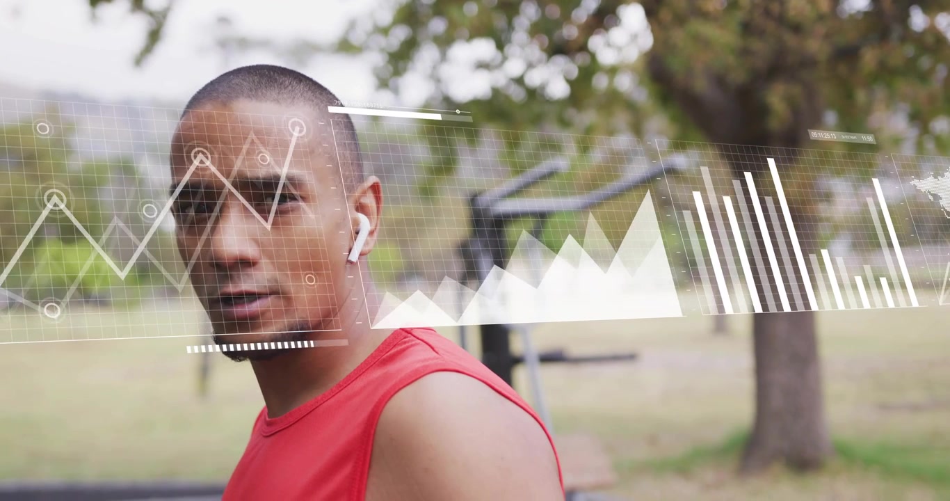 Male athlete turning head toward camera starting fitness graphs bars showing metrics across torso