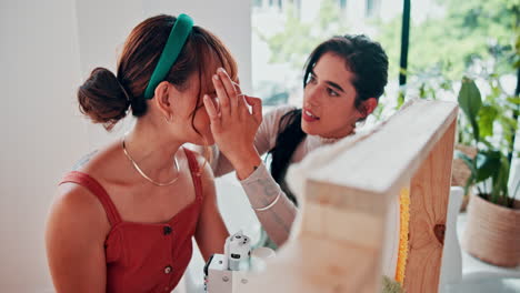 two women friends in a creative studio