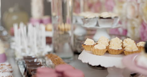 cute candy bar with various cakes and candies wedding candybar 6