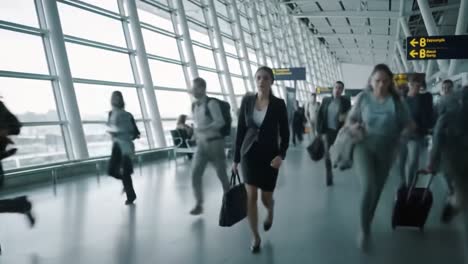 a fast-paced journey through the airport: a woman in a black suit navigates the hustle and bustle of travelers with urgency and purpose