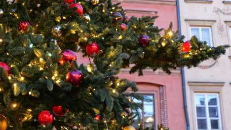 christmas tree with glass balls ornaments glittering at dusk, holiday season