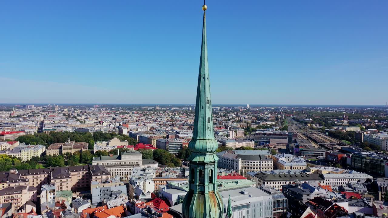 Spire of St Peters Church stands tall as drone rises above central Riga Latvia