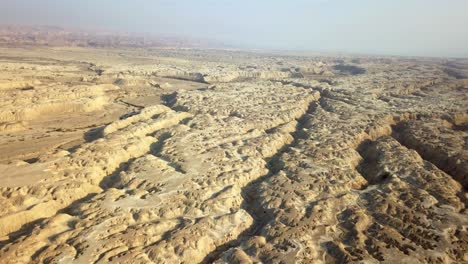 aerial view over large wadi with soft sedimentary rock, arava desert