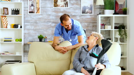 Old-woman-in-nursing-home-sitting-on-couch