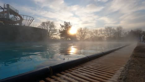 swimming pool with hot water in spa and wellness resort at dusk