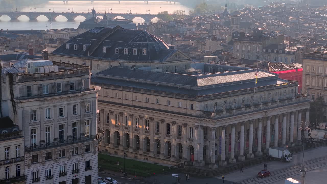Aerial view of the Grand Theater of Bordeaux in the city center with the Pont de Pierre bridge in the background