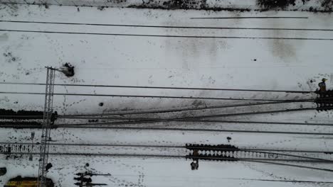 railroad tracks through dirty snow