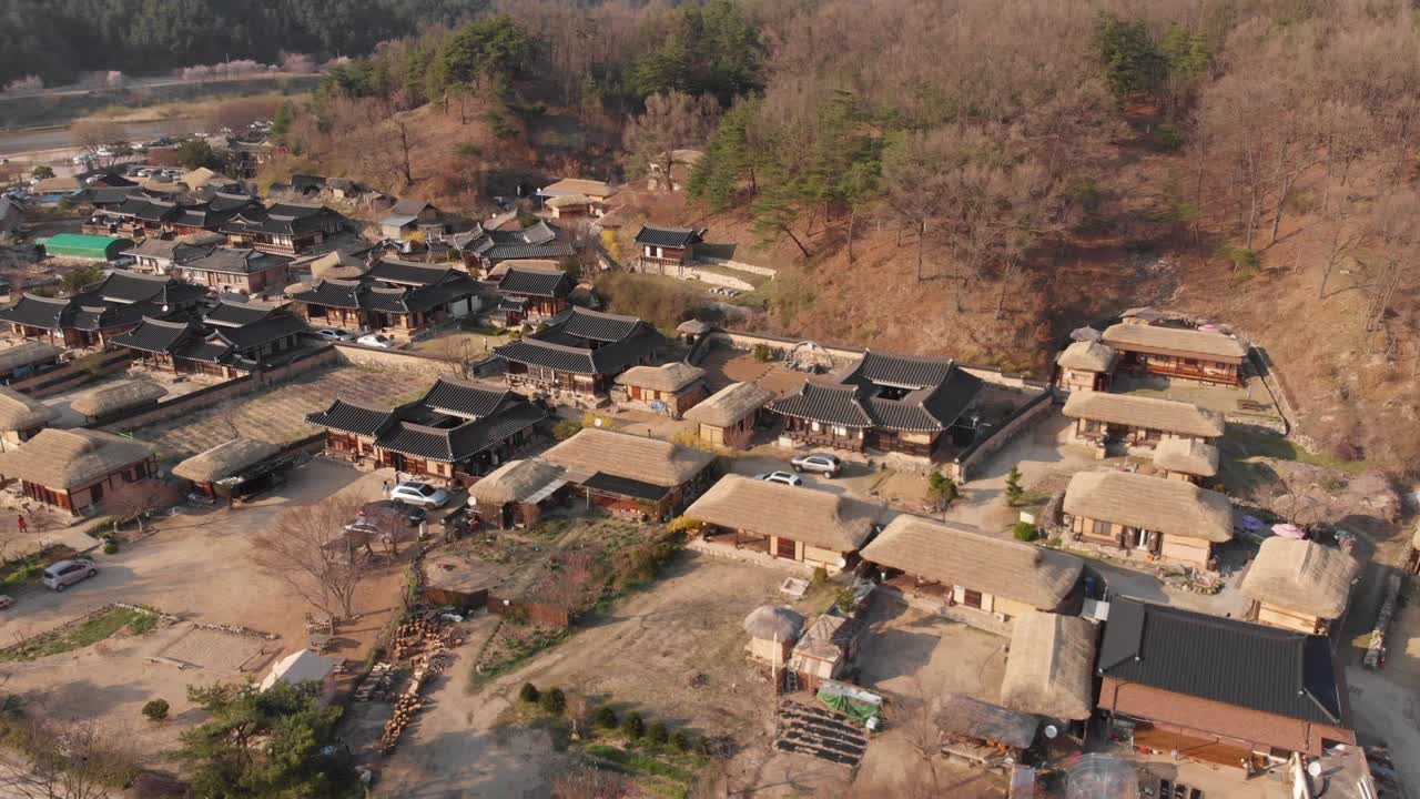 Aerial gentle rise up tilt down above Korean traditional village